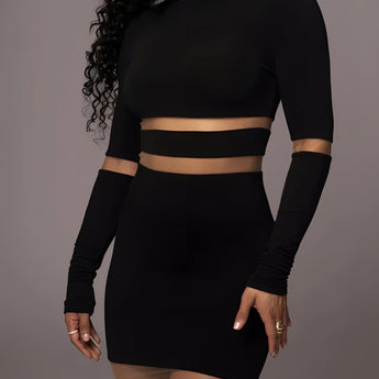 Black long sleeve midi cocktail dress with sheer mesh detail and curve-hugging fit.
