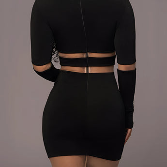 
A black long sleeve midi cocktail dress made from sheer mesh fabric with a curve-hugging sheath silhouette. The dress features a sleek and elegant design, showcasing shoulders and knees, emphasizing the body's natural shape.