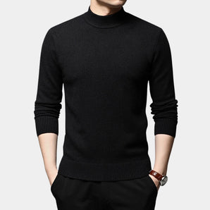 Black men's slim fit wool turtleneck sweater in size 4XL, featuring long sleeves and a fitted design. The sweater is styled for winter fashion, shown in a solid black color, worn by a person.