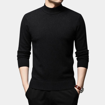 Black men's slim fit wool turtleneck sweater in size 4XL, featuring long sleeves and a fitted design. The sweater is styled for winter fashion, shown in a solid black color, worn by a person.