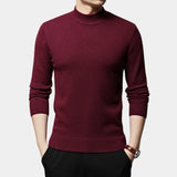 Men's slim fit wool turtleneck sweater in black, showcasing winter fashion. The image features a close-up of the sweater's neckline, sleeves, and waist, highlighting its sleek design with a model wearing a stylish watch. The sweater is complemented by a dress shirt collar peeking through.