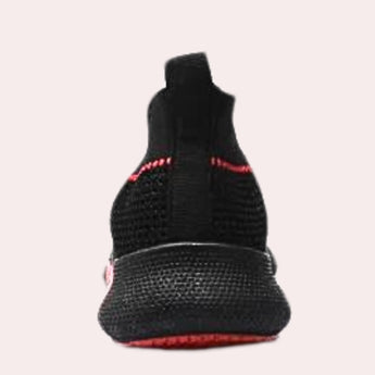 Black slip-on sneakers for men featuring breathable mesh material and red accents, with a flexible sole designed for comfort and style.