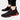 Black men's slip-on sneakers featuring breathable mesh material and red accents, designed with a flexible sole suitable for outdoor and walking activities.
