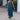 
A green XL luxury designer evening gown featuring an off-shoulder design with tiered fringe detailing.