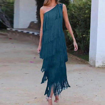 
A green XL luxury designer evening gown featuring an off-shoulder design with tiered fringe detailing.