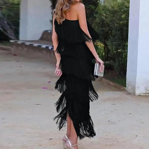 Elegant black off-shoulder evening gown with tiered fringe detailing, showcasing a luxurious designer style.