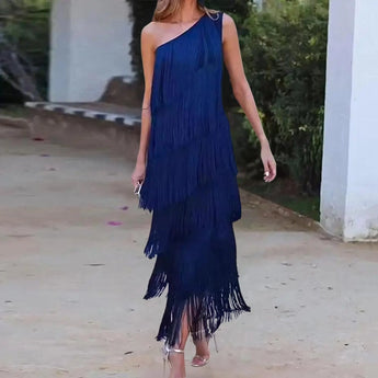 Elegant blue off-shoulder evening gown with tiered fringe detailing, showcasing luxurious design and fashion-forward style, suitable for formal occasions.