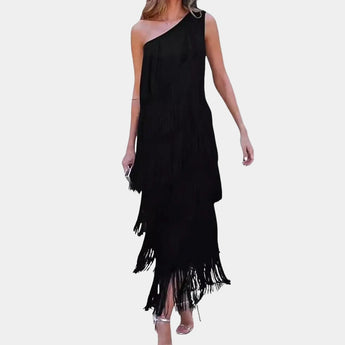 Black off-shoulder evening gown with tiered fringe detailing, showcasing a luxurious design with a sheath silhouette. The dress features a fitted waist and falls elegantly to the knee, highlighting its sleeveless and one-piece construction.