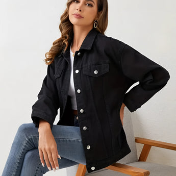 Woman wearing a black oversized denim jacket.