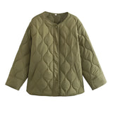 Women's lightweight urban puffer jacket in light green, featuring an oversized quilted design with long sleeves and a collar.
