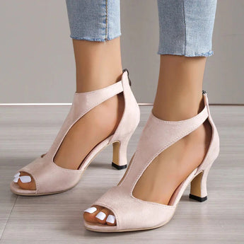 Black peep-toe heels featuring a comfortable low heel design, perfect for summer wear.