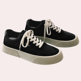 Black platform fashion sneakers with a textured sole and ankle-height design, suitable for walking and outdoor activities.