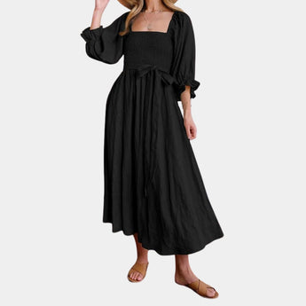 
Black puff sleeve midi dress with a tie waist, featuring elegant and casual design, suitable for spring, shown in a size 2XL.