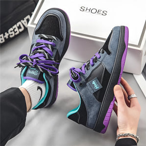 Black and purple skater shoes with dual-colored laces, featuring a sleek design ideal for urban youth fashion.