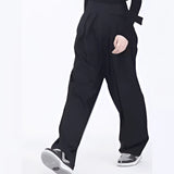 Black quick-dry sports shorts with an elastic waistband, designed for moisture-wicking and shown on a person wearing the shorts, highlighting the fit around the thighs and knees.