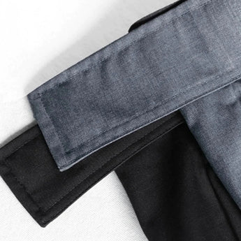 Black quick-dry sports shorts with an elastic waistband designed for moisture-wicking, featuring a sleek and modern look.