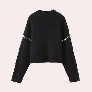 Black ribbed knit sweater with distressed sleeves and cut-out details, featuring a round collar and a casual, sporty style.