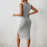 Black ribbed midi dress with a square neck and side slit, featuring a form-fitting design that accentuates the shoulders and legs.