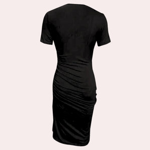 Black ruched midi dress with short sleeves, featuring an elegant and versatile sheath design.