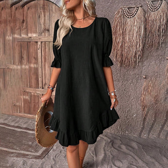 A black ruffle dress designed for women, featuring short sleeves and knee-length cut. The dress is one-piece with attention to the shoulder and waist fit, suitable for casual wear. Shown in size 3XL.