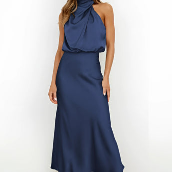 Black satin halter neck maxi dress in deep blue, designed as a women's formal evening gown, showcasing a sleeveless design with a fitted waist and flowing skirt reaching knee-length.