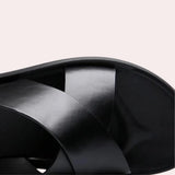 A glossy black satin headband with a wide design, showcasing an elegant and smooth texture, perfect for adding a sophisticated touch to hairstyles.