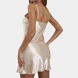 Black satin mini dress with adjustable straps, featuring an A-line silhouette and V-neck design, worn by a woman with long hair.