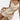 Black satin mini dress with adjustable straps, A-line silhouette, and a V-neck design, shown in beige color and size XL. The dress is sleeveless and falls above the thighs.