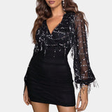 
A black sequin party dress featuring a sheer beaded blouse, open back, and elegant design with an emphasis on the shoulder and waistline, suitable for evening wear in a size XL.