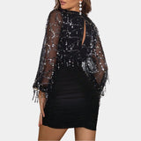Black sequin party dress featuring a sheer beaded blouse with an open back design, showcasing a sheath silhouette with detailed shoulder and neck embellishments and elegant sleeves.