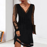 Black sequin V-neck mini dress with long sleeves, featuring a fitted silhouette that accentuates the waist and falls above the knee.