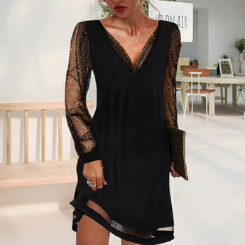 A plus-size black sequin cocktail mini dress featuring a V-neckline and long sleeves, designed to accentuate the waist and thighs for an elegant evening look.