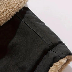 Black sherpa-lined winter jacket for men with a warm woolen lining, featuring a stylish collar and long sleeves.