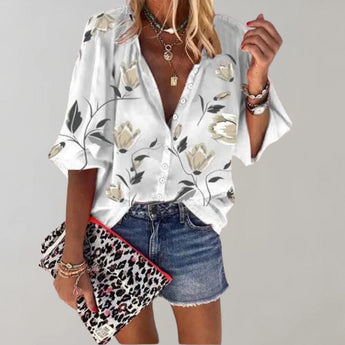 White short sleeve blouse with a v-neck design, suitable for casual summer wear.