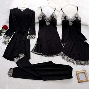 
A luxurious black silk pajama set for women, featuring delicate lace trim. The set is displayed on a hanger, showcasing its elegant design with long sleeves and a tailored waist, suitable for nighttime wear.