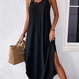 Black sleeveless maxi dress, casual style, ankle length with side pockets.