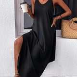 Black sleeveless maxi dress with side pockets, casual and ankle length, displayed on a mannequin.