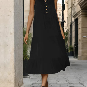 
A black sleeveless midi summer dress with a flowy design and button front, displayed against a white background. The dress is styled casually with a focus on its simple, elegant silhouette.