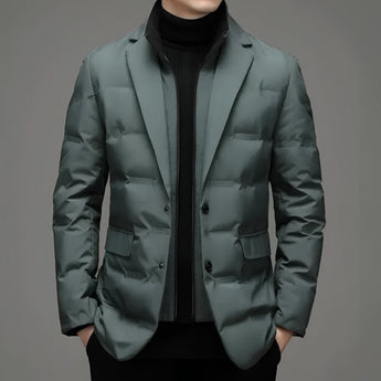 Black slim fit double-breasted blazer for men, featuring a structured silhouette with a notched collar, long sleeves, and grey accents, styled over a dress shirt for a formal, modern appearance.