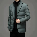 A modern men's formal jacket in green, featuring a slim fit and double-breasted design. The blazer has a structured collar, long sleeves, and multiple buttons. It is styled over an electric blue dress shirt, showcasing the blazer's sophisticated and polished look.