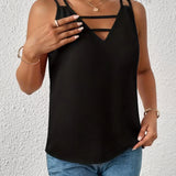 A woman wearing a black strappy V-neck tank top, suitable for lightweight summer streetwear, with focus on upper body including shoulders, arms, and neck.