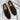 Brown men's designer loafers made from leather and composite materials, featuring a comfortable fit with synthetic rubber soles, showcasing a stylish pattern.