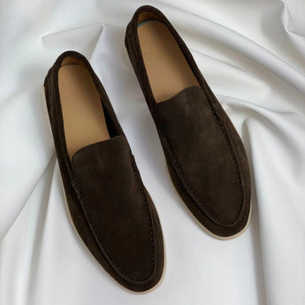 Brown men's designer loafers made from leather and composite materials, featuring a comfortable fit with synthetic rubber soles, showcasing a stylish pattern.