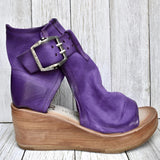 Black Suede Wedge Sandals in Purple with High Platform and Buckle Heel, shown on a human leg.
