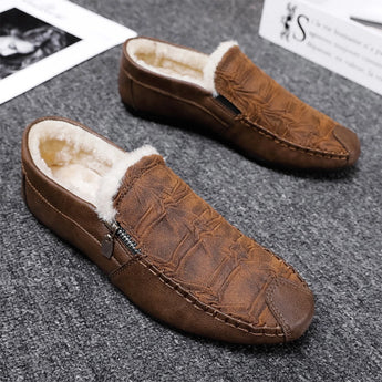 Black textured leather slip-on loafers for men with a zipper detail, showcasing a sleek and sophisticated design suitable for formal occasions.