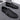 Black textured leather slip-on loafers with a zipper for men, featuring a stylish and sleek design with a smooth finish.