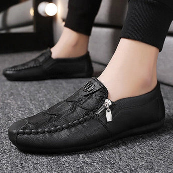 Black textured leather slip-on loafers with a zipper for men, shown in size 44, highlighting their stylish and sleek design.