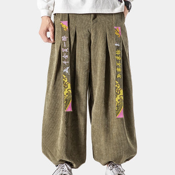 A pair of light green high-waist unisex wide-leg palazzo trousers displayed, featuring a modern design with a loose fit that exudes both style and comfort.