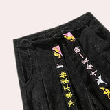 Black unisex wide-leg palazzo trousers with a high-waist, featuring a modern design suitable for various occasions.