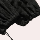 Black wide-leg palazzo trousers with a high-waist design, showcased on a plain background. The trousers are modern in style and unisex, with a relaxed and flowing fit.